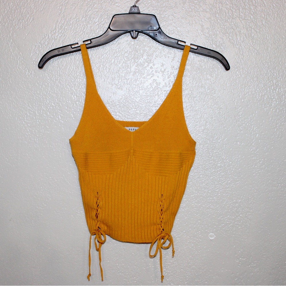 Papaya Small crop top. Very cute, has string on the side you can tie and adjust.
